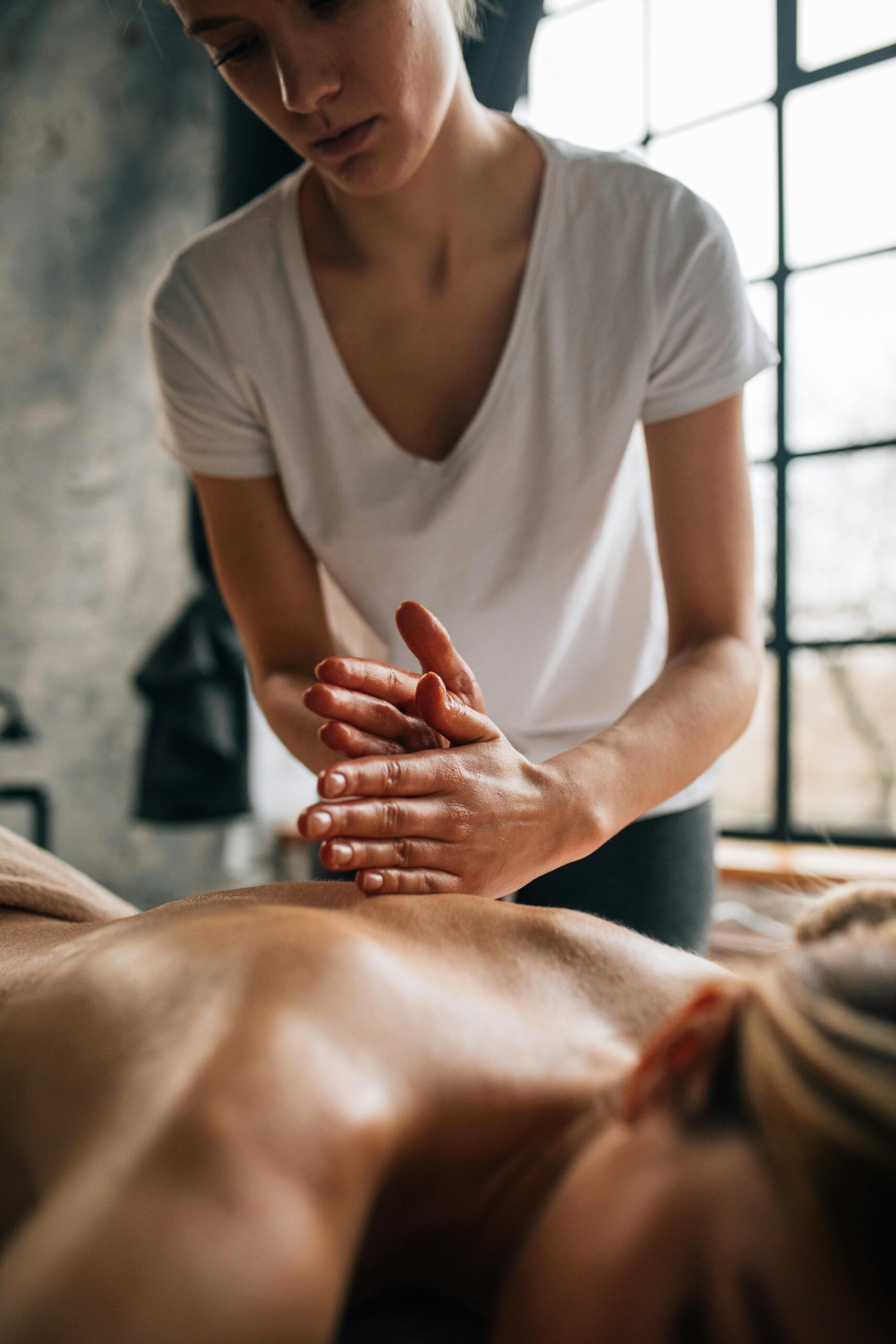 Services A soothing massage session in a tranquil indoor setting promoting wellness.
